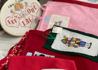 Cross stitching by Lynda. 
Lynda cross stitches on clothing and cards, does framed pictures, tablecloths and aprons...she loves to cross stitch!