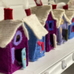 Fabric and sewn objects by Sylvia. Sylvia makes cozy mittens and little bags, felted and fashioned from wool sweaters; oven mitts, quill garlands, and puppet nativity scenes; needle felted mice, garlands, gnomes, and wool quillies