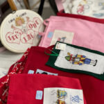 Cross stitching by Lynda. Lynda cross stitches on clothing and cards, does framed pictures, tablecloths and aprons...she loves to cross stitch!